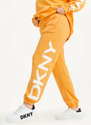 Yellow Women's Dkny Pigment Dye Distressed Crackle Logo Jogger Pants | 6183UWIMX